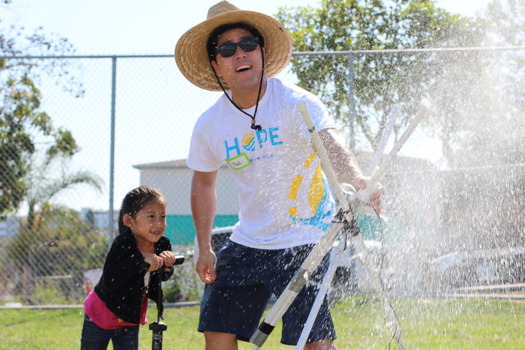 volunterr playing with kids at hope for san diego's annual day of service
